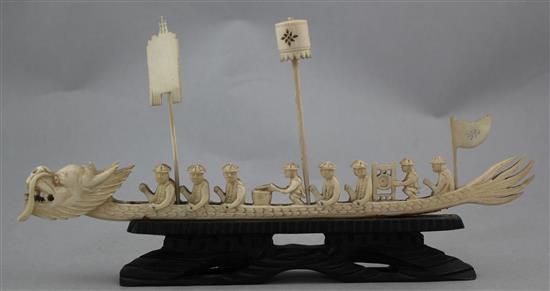 A Chinese ivory model of a dragon boat and four Indian ivory figures of ladies, early 20th century, 10.5cm. - 28cm.